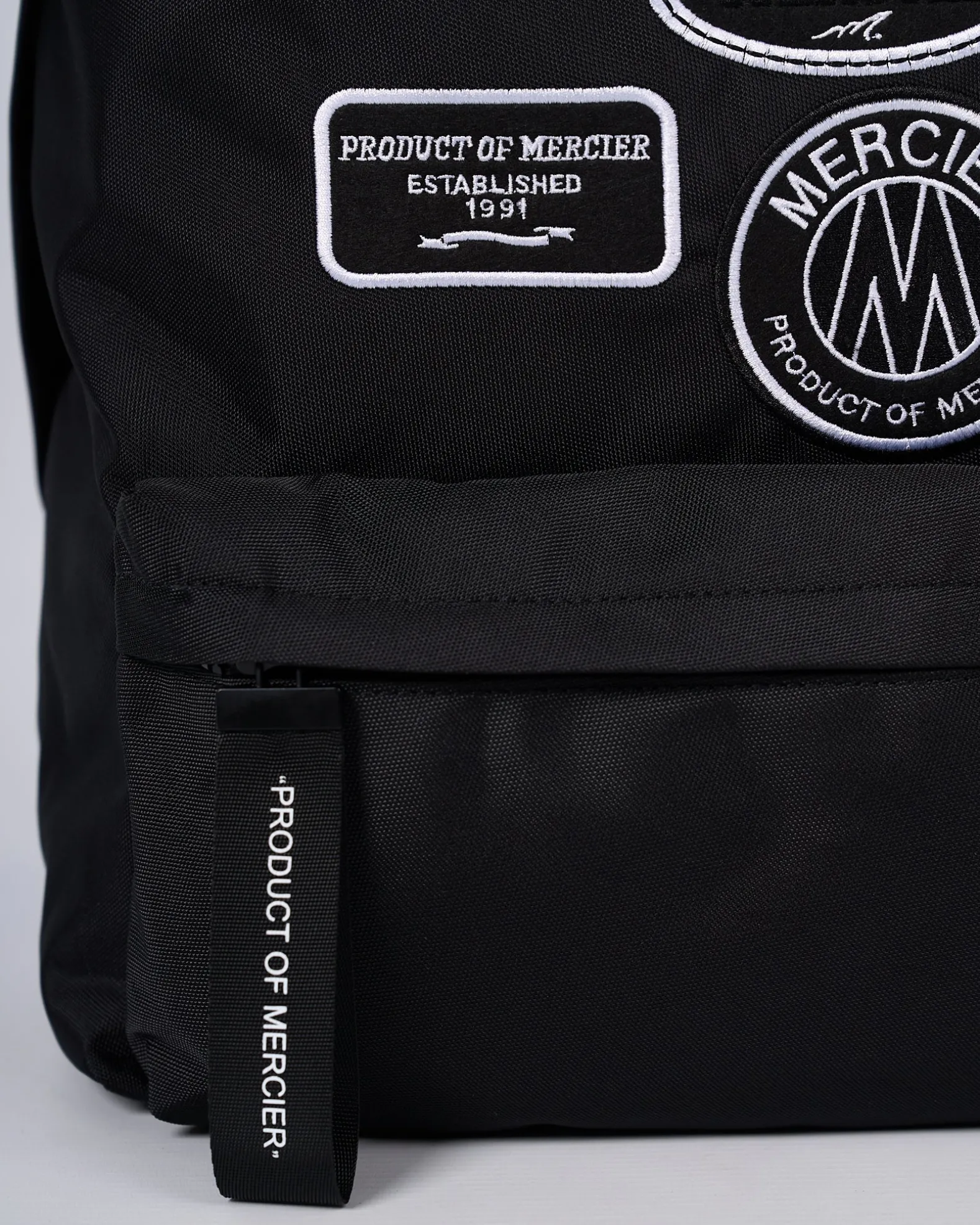Black Mono Badge Backpack