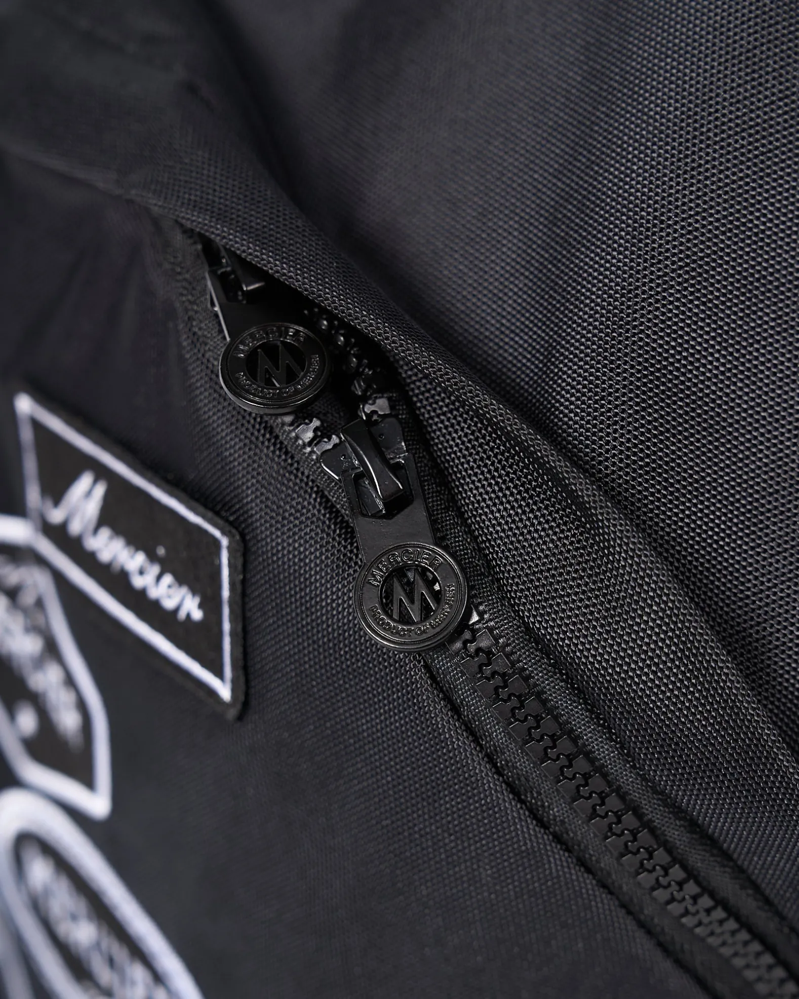 Black Mono Badge Backpack